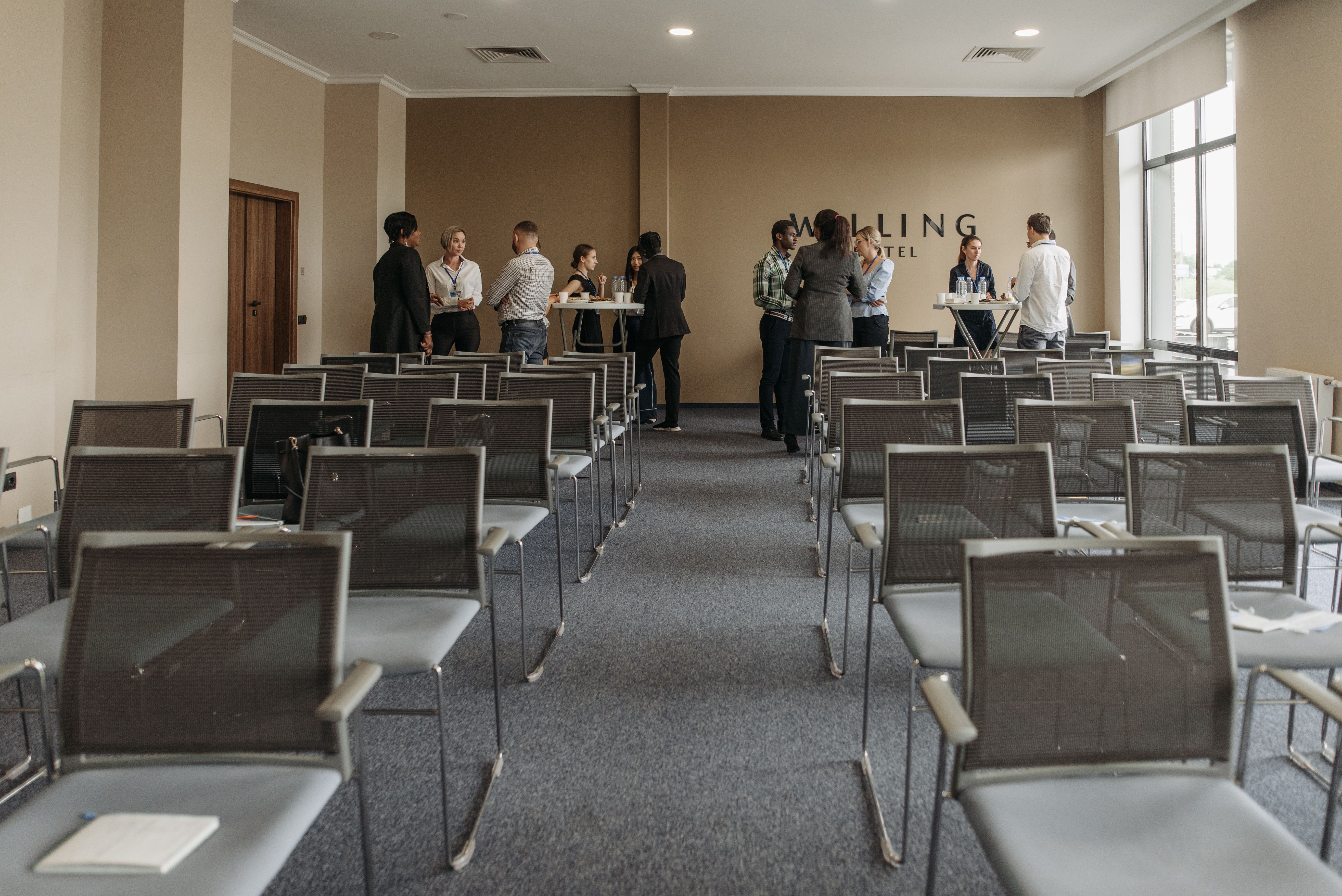 Business professionals networking in a conference room building backlink partnerships