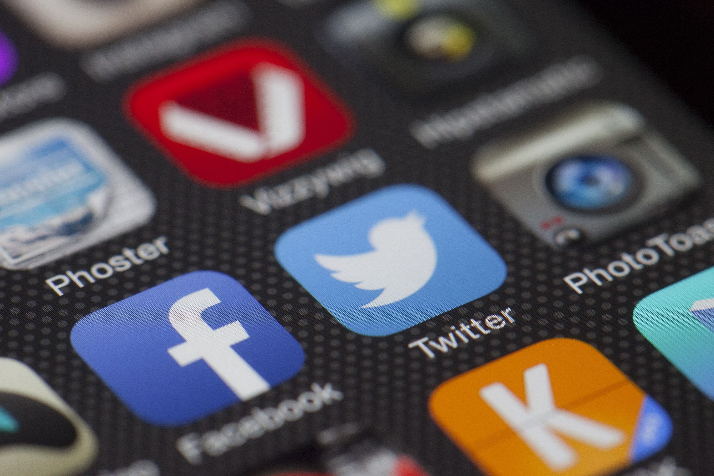 Close-up of social media icons on a smartphone screen representing online reputation